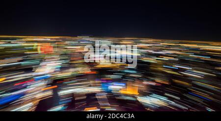 Abstract Background. Light Trails Caused by Skyscraper Rooftop Rotating Platform Stock Photo