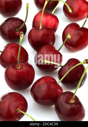 BIGARREAU CHERRIES (FRENCH SPECY) AGAINST WHITE BACKGROUND Stock Photo