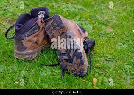 Norwich, Norfolk, UK – November 17 2020. An illustrative photo of a pair of well-worn and muddy Hi-Tec walking boots Stock Photo