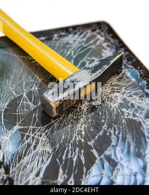 hammer on the broken display tablet Stock Photo