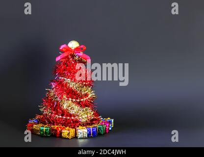 Christmas tree made of shiny bright decorative garland Stock Photo