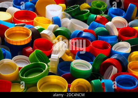 Macro image of multi-colored caps from bottles, an excellent raw material for recycling. Stock Photo