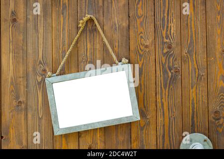 white blank space board with rope on wooden door of a coffee shop, clipping path Stock Photo