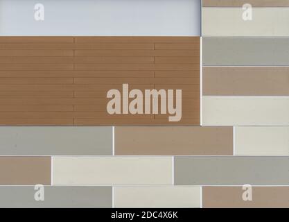 decorative rectangular pattern siding with brick veneer on a new strip mall wall Stock Photo