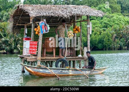 A local store setting up for a days trading on the Madu River near Balapitiya in western Sri Lanka. The store has been built on stilts. Stock Photo