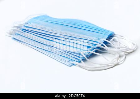 Blue three ply surgical mask on white Stock Photo