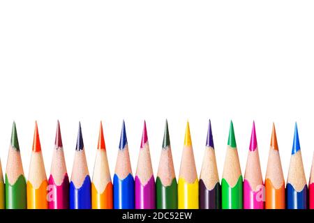 Sharp coloured wooden pencils. Isolated down border. Close-up. Creativity and education concept.  Stock Photo