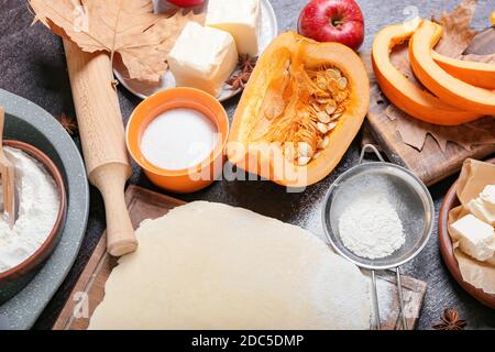 Ingredients for preparing pumpkin pie on dark background Stock Photo
