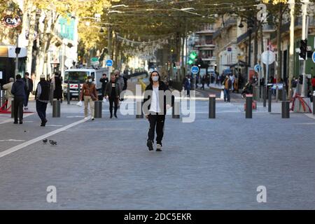 November 17, 2020: Marseille, France. 17 November 2020. Daily life in the streets near the old harbour of Marseille while a second Covid lockdown is imposed on the city and the entire country. In the last few weeks France has seen a major surge in coronavirus cases, with the number of people in hospital care for Covid-19 in the country being currently higher than during the first wave in April. Most people abide by the health restrictions, which include the wearing of a protective face mask. France is due to remain in lockdown until at least December 1st, with hopes that if the country's Covid Stock Photo