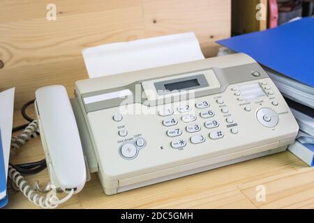 The fax machine use for Sending documents in the office, concept equipment needed in office Stock Photo