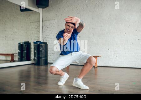 Man making extensive and complicated movements while dancing Stock Photo