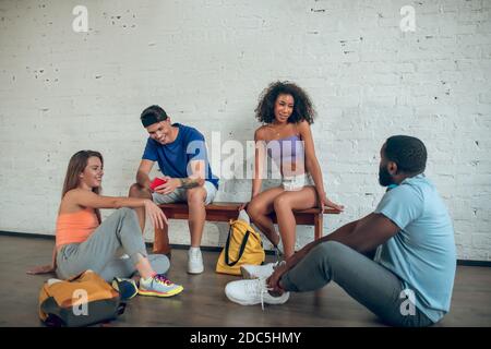 Group of dancers discussing their past rehearsal Stock Photo