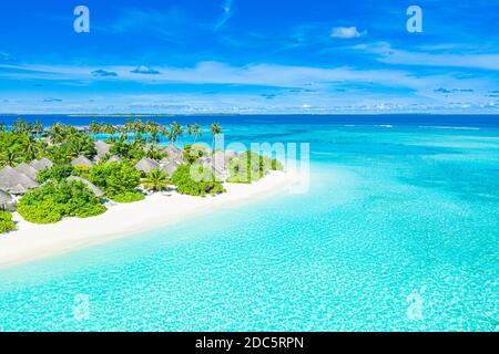 Aerial view of beach in Maldives luxury resort villas, bungalows. Seascape, paradise island landscape, tropical nature pattern. Amazing drone view Stock Photo