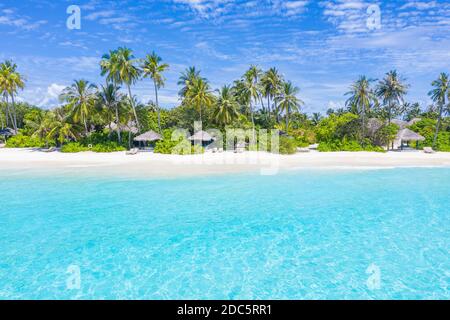 Aerial view of beach in Maldives luxury resort villas, bungalows. Seascape, paradise island landscape, tropical nature pattern. Amazing drone view Stock Photo