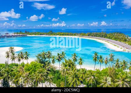 Aerial landscape with tropical resort villas, bungalow, palm trees and amazing sea shore. Travel destination, luxury vacation, summer nature scene