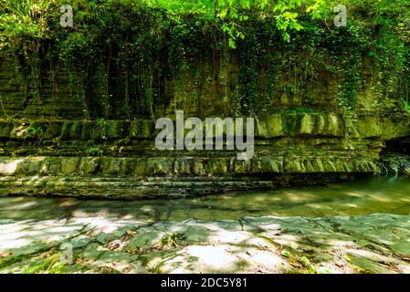 Textures of various stone layers in mountain river Stock Photo