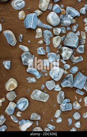 Pebbles and sand in the Severn estuary. Stock Photo