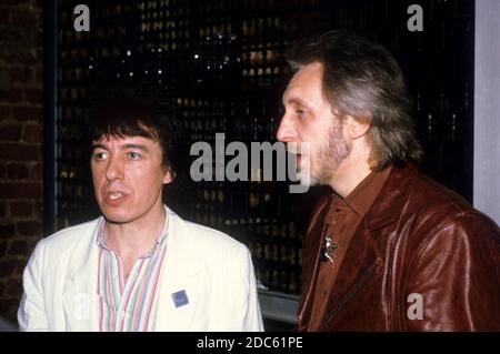 Bill Wyman from Willie and the Poor Boys and John Entwistle from The Who at a press conference. London, April 18, 1985 | usage worldwide Stock Photo