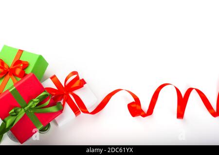 A curly gold ribbon for Christmas and birthday present banner isolated  against a white background Stock Photo - Alamy