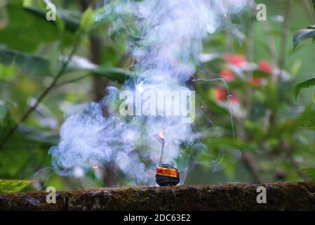 Green colour cracker starts firing Stock Photo