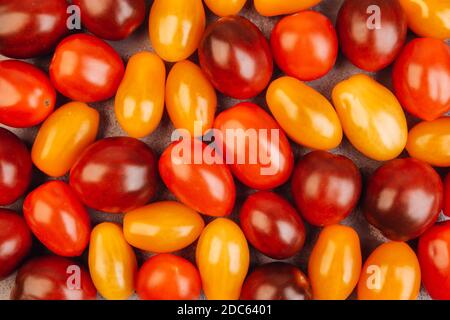 Cherry tomatoes on gray marble background. Stock Photo