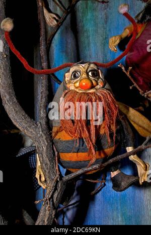 Half man, half insect: appealing designs for puppets, marionettes and dolls on offer to tourists in Prague, capital of Czechia / Czech Republic, include this furry little red-bearded character with orange and black body stripes, huge furry antennae, extra-long human arms and a bright red nose.  Prague’s traditional mannequin and puppet retailers help to maintain distinctive Bohemian folklore and craft traditions stretching back to at least the 16th century. Stock Photo