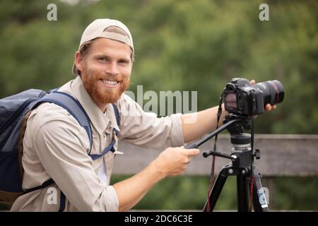 wild life nature photographer take a picture in field Stock Photo