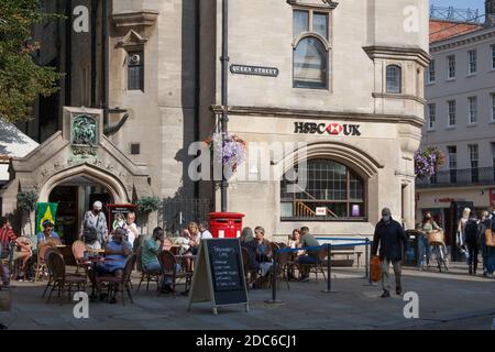 The HSBC Bank on Carfax in Oxford with people eating outside on a terrace in the UK, taken on the 15th of September 2020