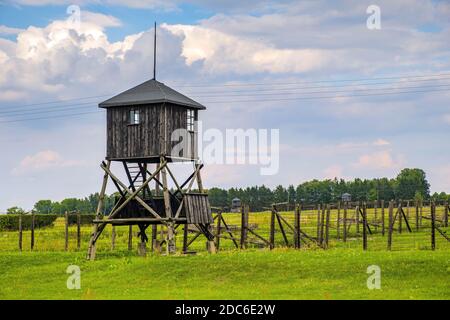 Lublin, Lubelskie / Poland - 2019/08/17: Guards towers and barbed-wire fences of Majdanek KL Lublin Nazis concentration and extermination camp - Konze Stock Photo