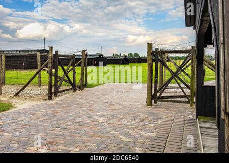 Lublin, Lubelskie / Poland - 2019/08/17: Guards towers and barbed-wire fences of Majdanek KL Lublin Nazis concentration and extermination camp - Konze Stock Photo