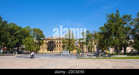 Lublin, Lubelskie / Poland - 2019/08/18: Panoramic view of Plac Litewski square with multimedia fountain in historic old town quarter Stock Photo
