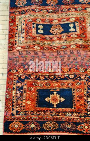 Isfahan Iran. A display of Persian carpet, Kilim, rug with traditional motifs is for sale on the street at Isfahan.  Stock Photo