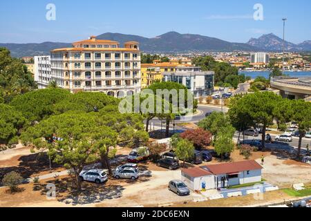 Olbia, Sardinia / Italy - 2019/07/21: Panoramic view of Olbia port area and Grand Hotel President with Cabu Abbas hills in background Stock Photo