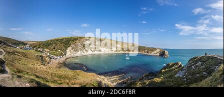 Picturesque coastal view of Lulworth Cove and Portland limestone cliff strata on the Jurassic Coast World Heritage site in Dorset, south-west England Stock Photo