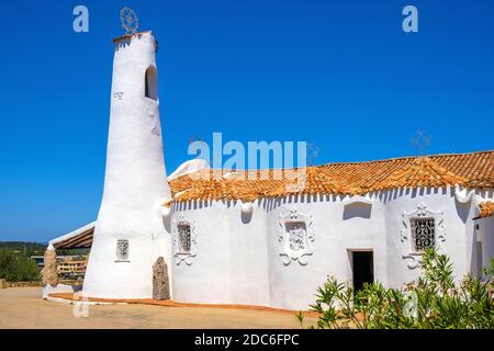 Porto Cervo, Sardinia / Italy - 2019/07/20: Chiesa Stella Maris church overlooking port and residences of Porto Cervo resort at the Costa Smeralda coa Stock Photo