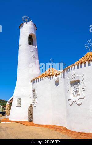 Porto Cervo, Sardinia / Italy - 2019/07/20: Chiesa Stella Maris church overlooking port and residences of Porto Cervo resort at the Costa Smeralda coa Stock Photo