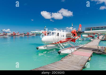 Male, Maldives May 10, 2019: TMA - Trans Maldivian Airways Twin Otter seaplanes at Male airport (MLE) in the Maldives. Seaplane parking next to float Stock Photo