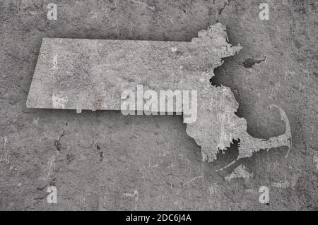 Map of Massachusetts on weathered concrete Stock Photo