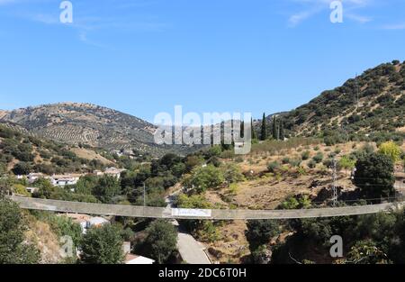 Frailes, Sierra Sur, Jaen, Andalusia Spain. Image  of the suspended bridge across the ravine in village renowned for its healing waters and M. Jacobs. Stock Photo