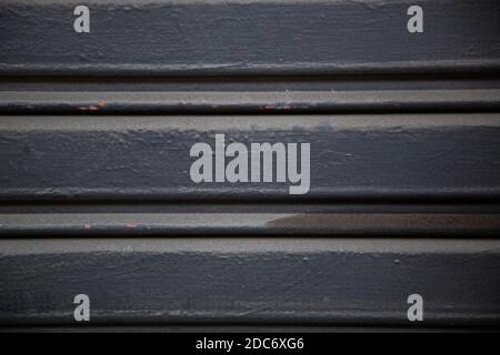 A closeup shot of an old corrugated metal wall texture background Stock Photo