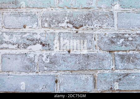 white old brick wall with peeling paint background, texture, place for text. Stock Photo