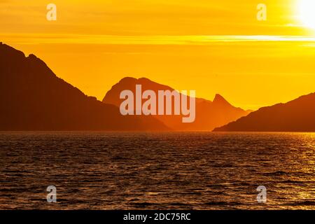 Mountainous landscape at sunset from the sea Stock Photo