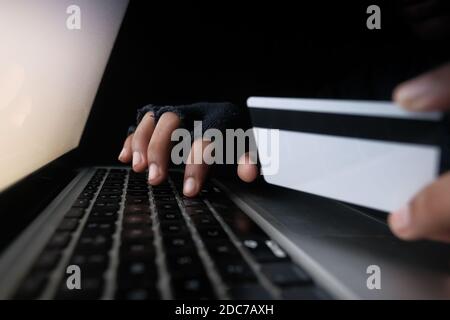 hacker hand stealing data from credit card  Stock Photo