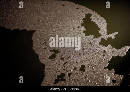 Background of dark brown coffee foam Stock Photo