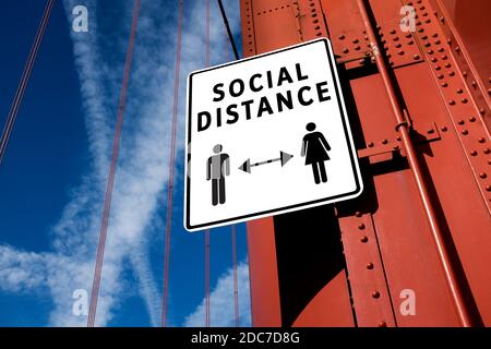 SOCIAL DISTANCE sign informing people to stay apart & keep away from each other,prevention & protection of Coronavirus spread & transfer,COVID-19 pand Stock Photo