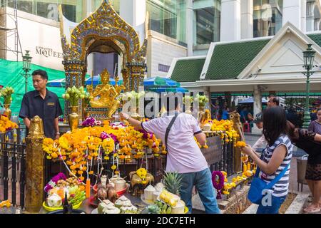 Many Thais offer prayers at the popular Erawan Shrine in Bangkok, Thailand Stock Photo