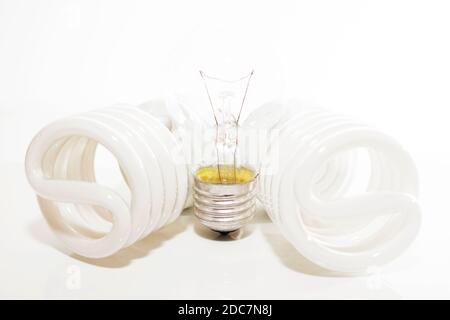 Several different led bulbs and compact fluorescent lamps with the size of the male screw base E27 on a light background Stock Photo