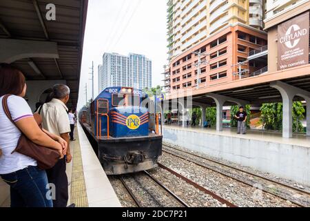 A PNR train arriving at the Dela Rosa Station in Makati City, Philippines Stock Photo