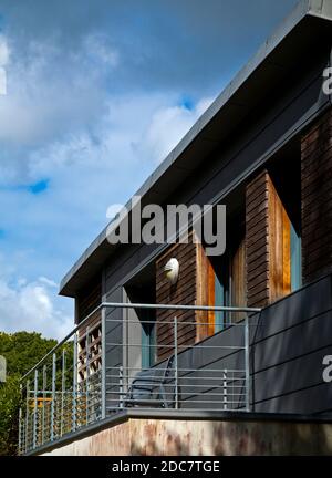 Modern house with balcony and metal rails. Stock Photo