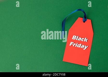 Black Friday sale red tag on green with copy space for text or ad. Black Friday concept. Copy space Stock Photo